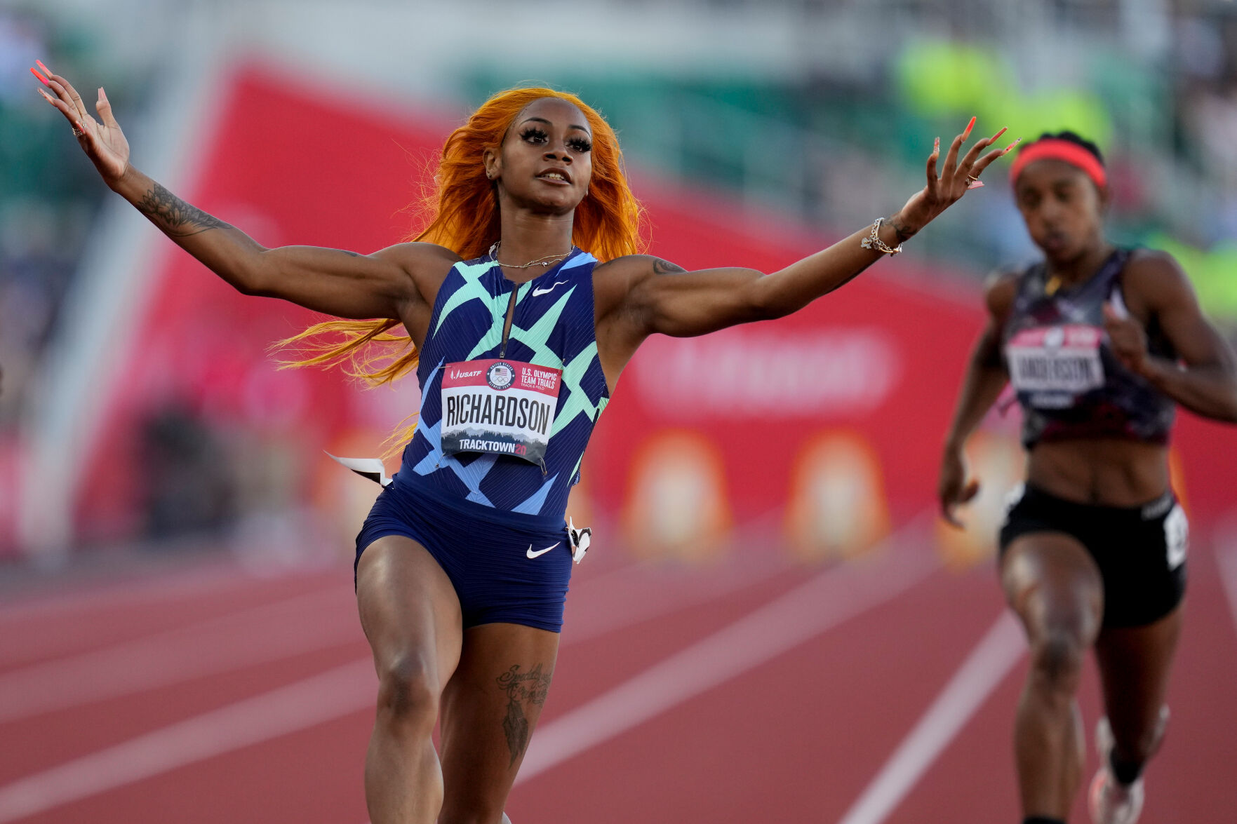 Sha'Carri Richardson celebrates after winning the fourth heat of the 100-meter run